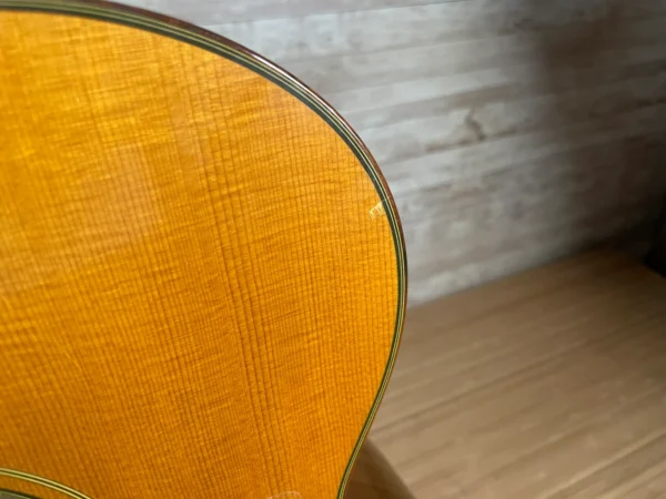 Stunning Made in Canada Jumbo acoustic. 1995. Solid cedar top with ornate koa back and sides. Very nice rosette and beautiful inlays on the fingerboard, and check out that headstock! Large, rich and loud tone with Fishman electronics. Some light general wear throughout as pictured, but nothing significant. Playing great with a fresh setup. Includes original hardshell case.