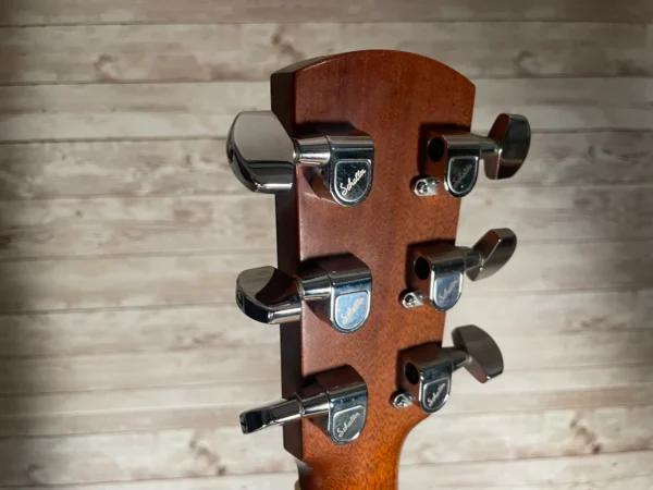 Stunning Made in Canada Jumbo acoustic. 1995. Solid cedar top with ornate koa back and sides. Very nice rosette and beautiful inlays on the fingerboard, and check out that headstock! Large, rich and loud tone with Fishman electronics. Some light general wear throughout as pictured, but nothing significant. Playing great with a fresh setup. Includes original hardshell case.