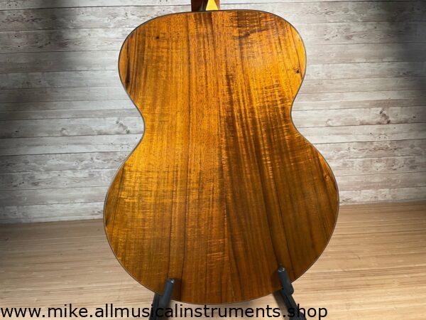 Stunning Made in Canada Jumbo acoustic. 1995. Solid cedar top with ornate koa back and sides. Very nice rosette and beautiful inlays on the fingerboard, and check out that headstock! Large, rich and loud tone with Fishman electronics. Some light general wear throughout as pictured, but nothing significant. Playing great with a fresh setup. Includes original hardshell case.