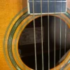 Stunning Made in Canada Jumbo acoustic. 1995. Solid cedar top with ornate koa back and sides. Very nice rosette and beautiful inlays on the fingerboard, and check out that headstock! Large, rich and loud tone with Fishman electronics. Some light general wear throughout as pictured, but nothing significant. Playing great with a fresh setup. Includes original hardshell case.