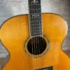 Stunning Made in Canada Jumbo acoustic. 1995. Solid cedar top with ornate koa back and sides. Very nice rosette and beautiful inlays on the fingerboard, and check out that headstock! Large, rich and loud tone with Fishman electronics. Some light general wear throughout as pictured, but nothing significant. Playing great with a fresh setup. Includes original hardshell case.