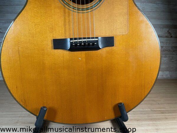 Stunning Made in Canada Jumbo acoustic. 1995. Solid cedar top with ornate koa back and sides. Very nice rosette and beautiful inlays on the fingerboard, and check out that headstock! Large, rich and loud tone with Fishman electronics. Some light general wear throughout as pictured, but nothing significant. Playing great with a fresh setup. Includes original hardshell case.